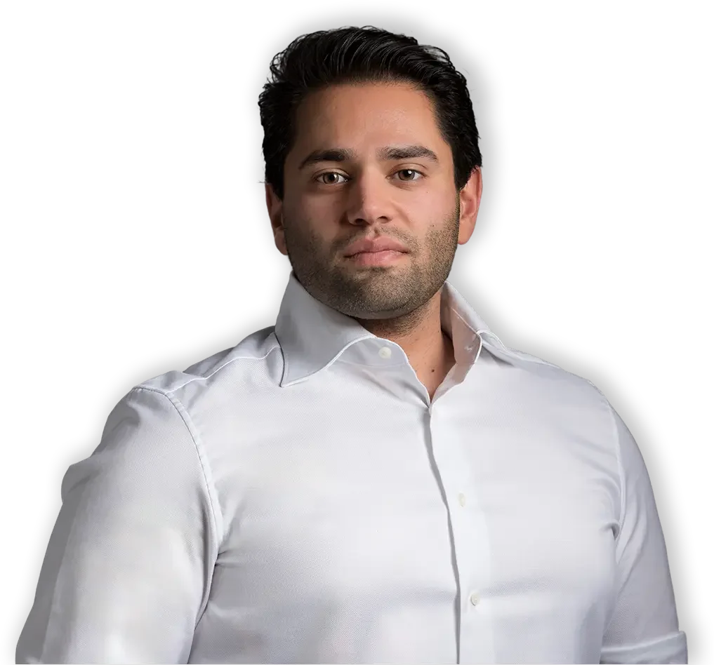 Attorney Kent Grover stands in a white button-up shirt