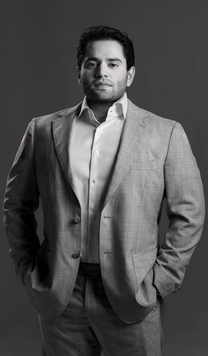 Attorney Kent Grover stands in a suit